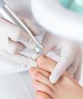 Table top pedicure close-up with cuticle work