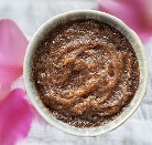 Chocolate scrub with rose petals in background