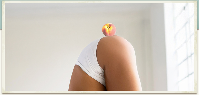 Woman bending over with a peach atop