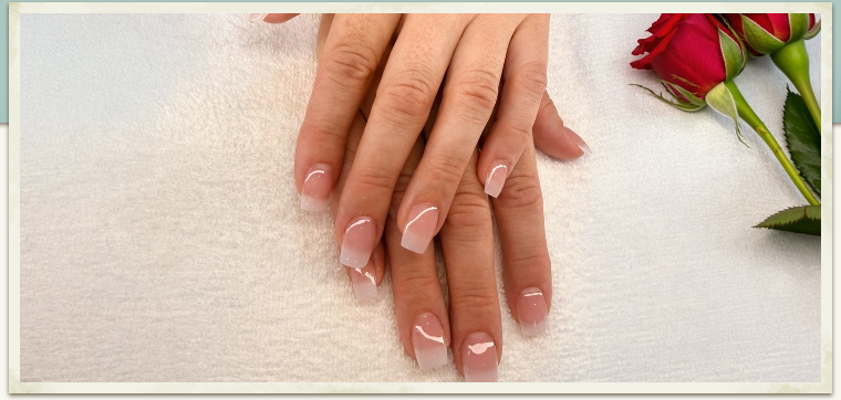 American French acrylic nails with red roses.